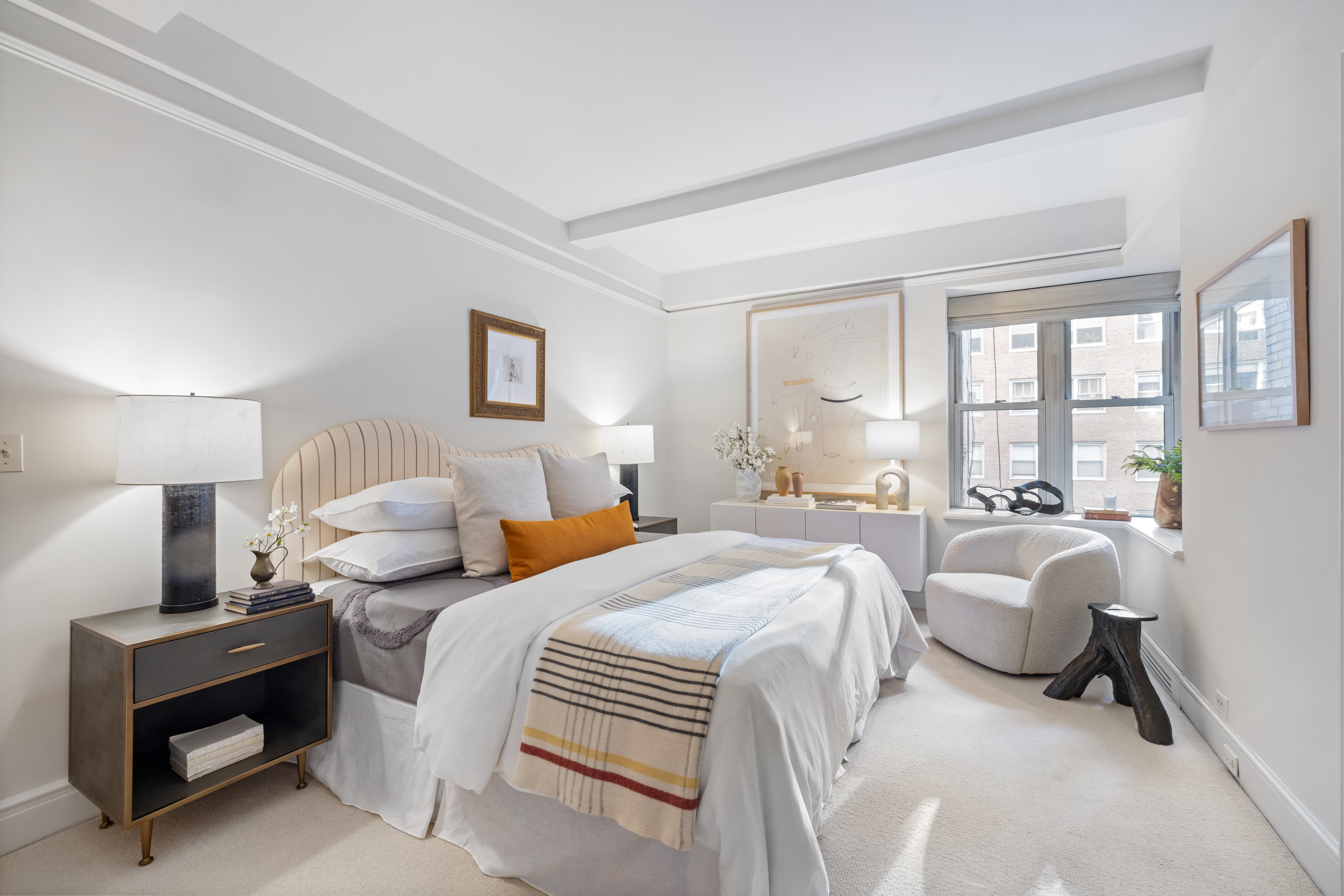 320 East 72nd Street, Unit 5B Manhattan, NY 10021 - Photo 10 of 18 a bedroom with two beds and a large window