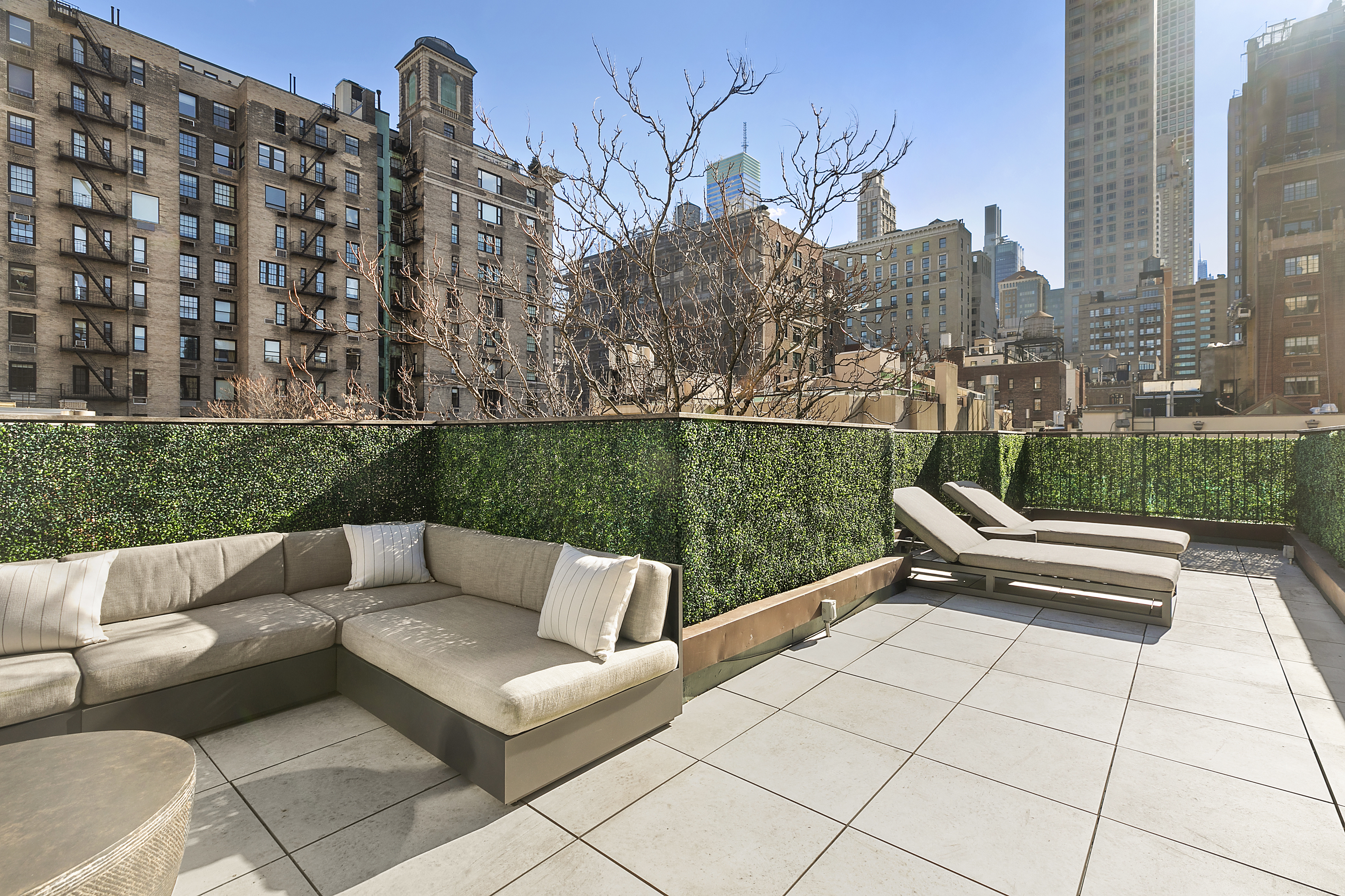 36 East 64th Street Manhattan, NY 10065 - Photo 24 of 27 a view of a terrace with couches and a fire pit