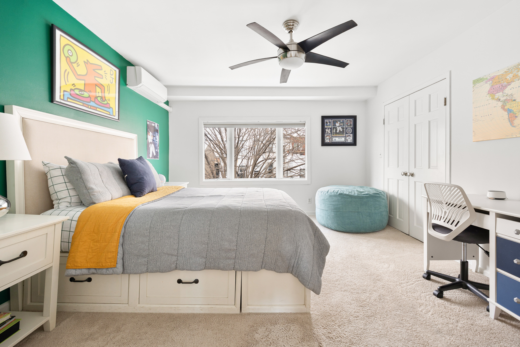 202 22nd Street Brooklyn, NY 11232 - Photo 19 of 28 a bedroom with a bed a couch and a window