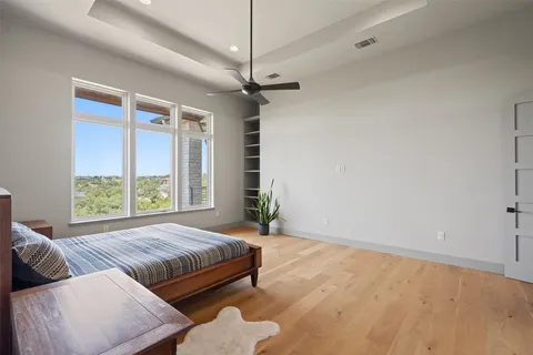 a bedroom with furniture and a window