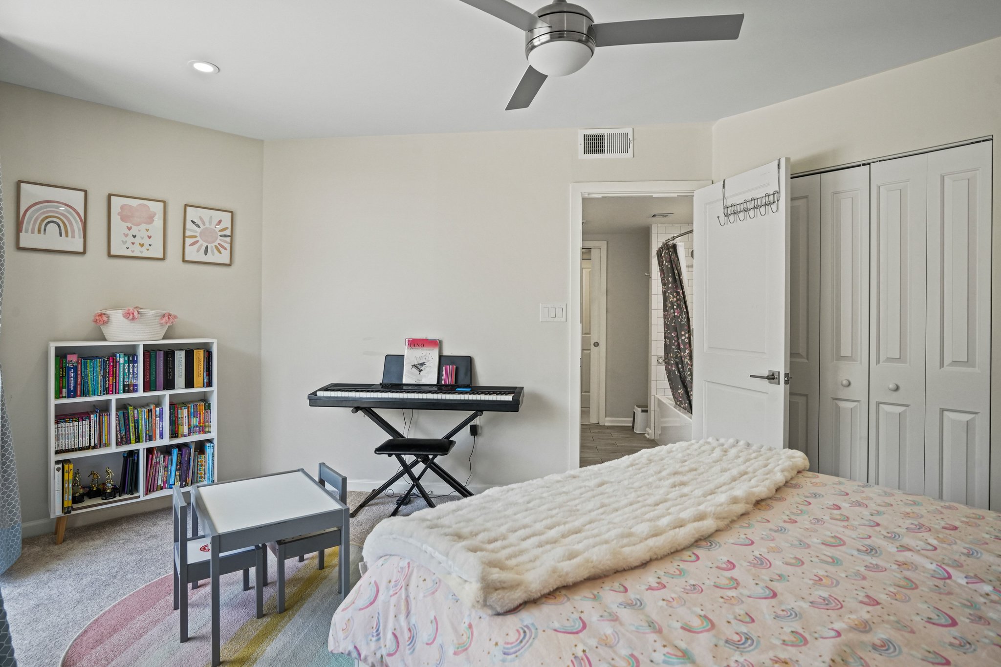 2725 Connecticut Avenue Northwest, Unit 507 Washington, DC 20008 - Photo 23 of 31 a bedroom with a bed a table and a book shelf