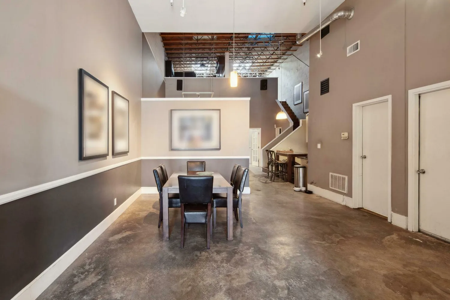 a dining room with furniture and entryway