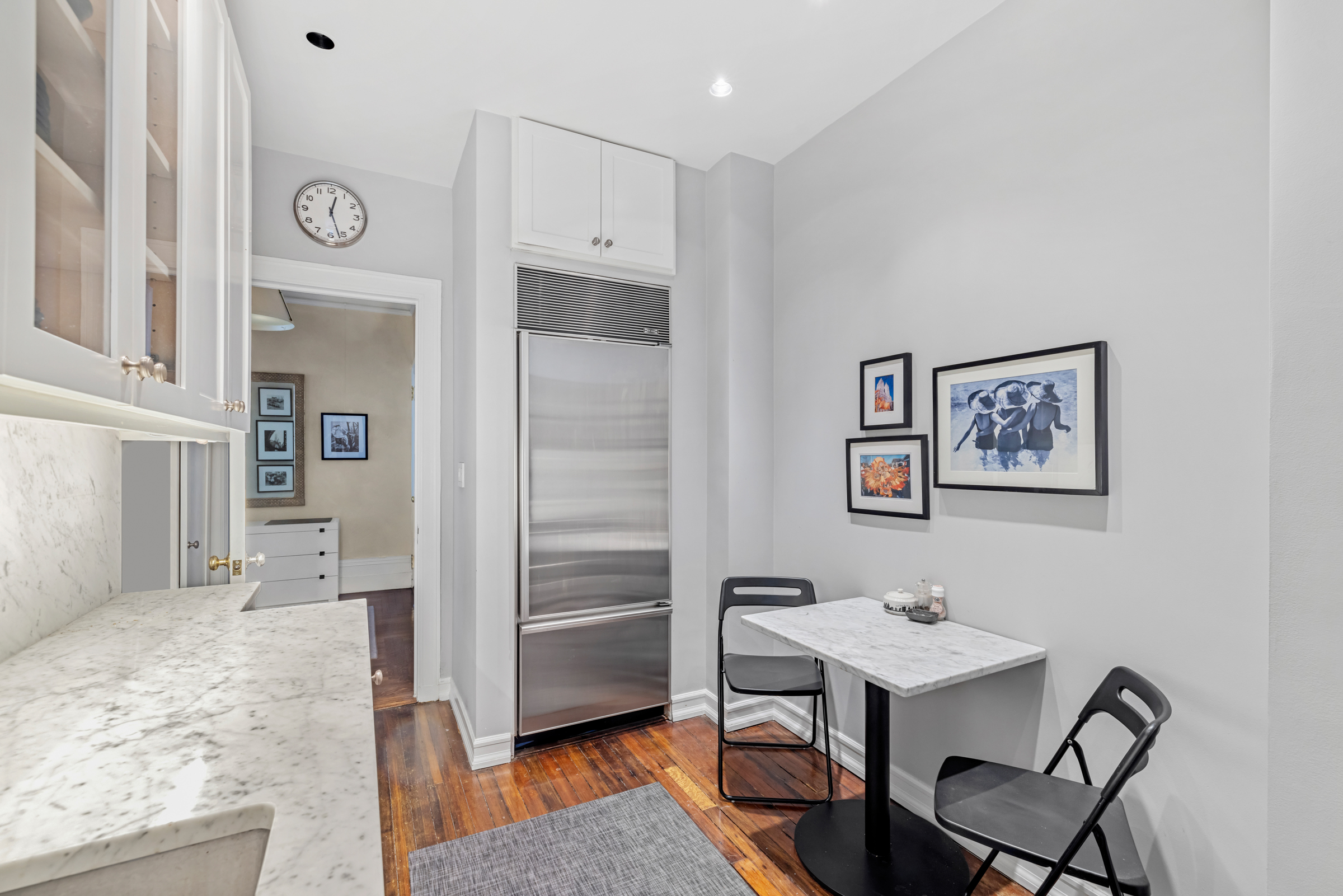 50 West 67th Street, Unit 5F Manhattan, NY 10023 - Photo 6 of 13 a spacious bathroom with a sink a mirror a bathtub and a shower
