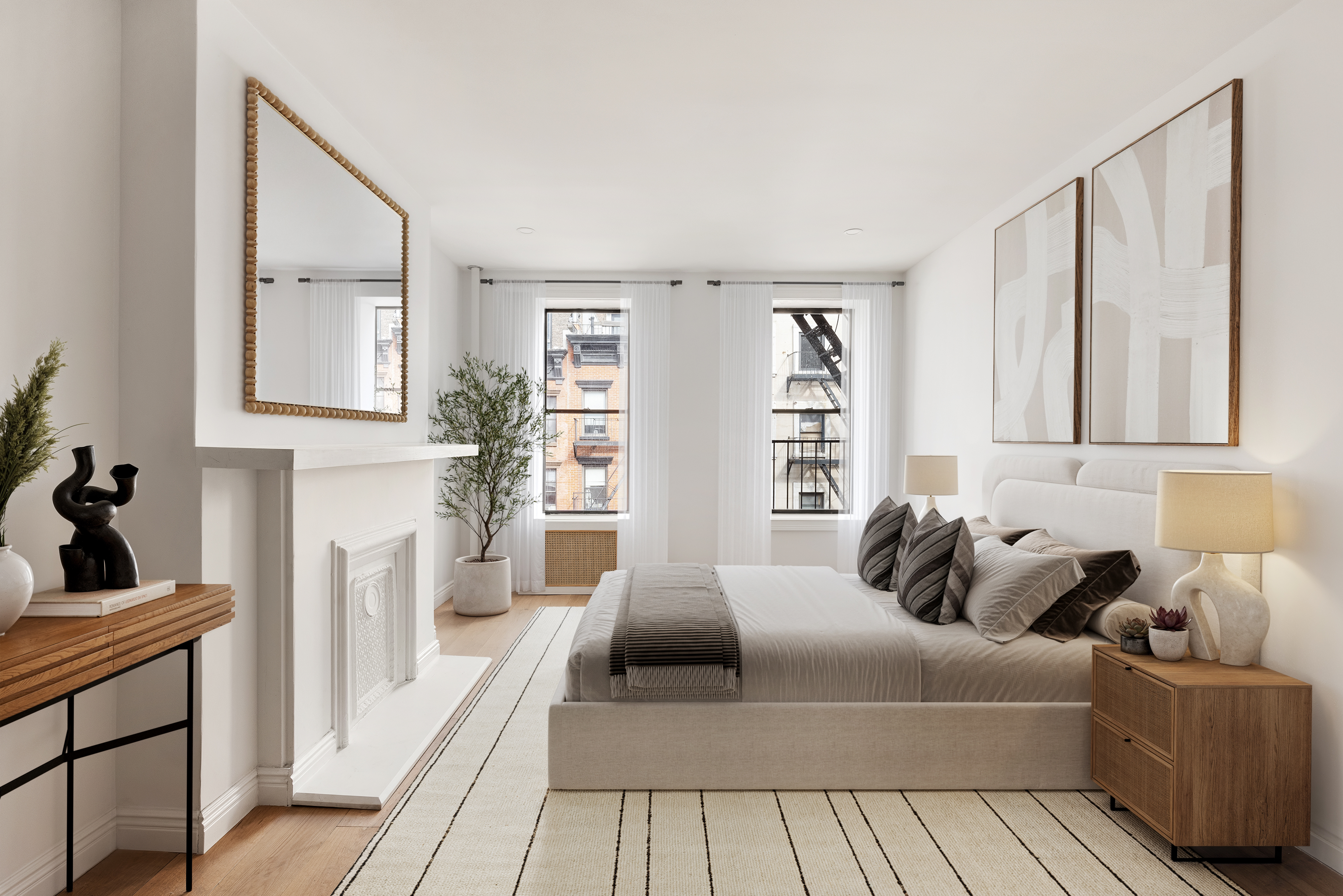 228 West 16th Street, Unit 4B Manhattan, NY 10011 - Photo 7 of 9 a bedroom with furniture and a fireplace