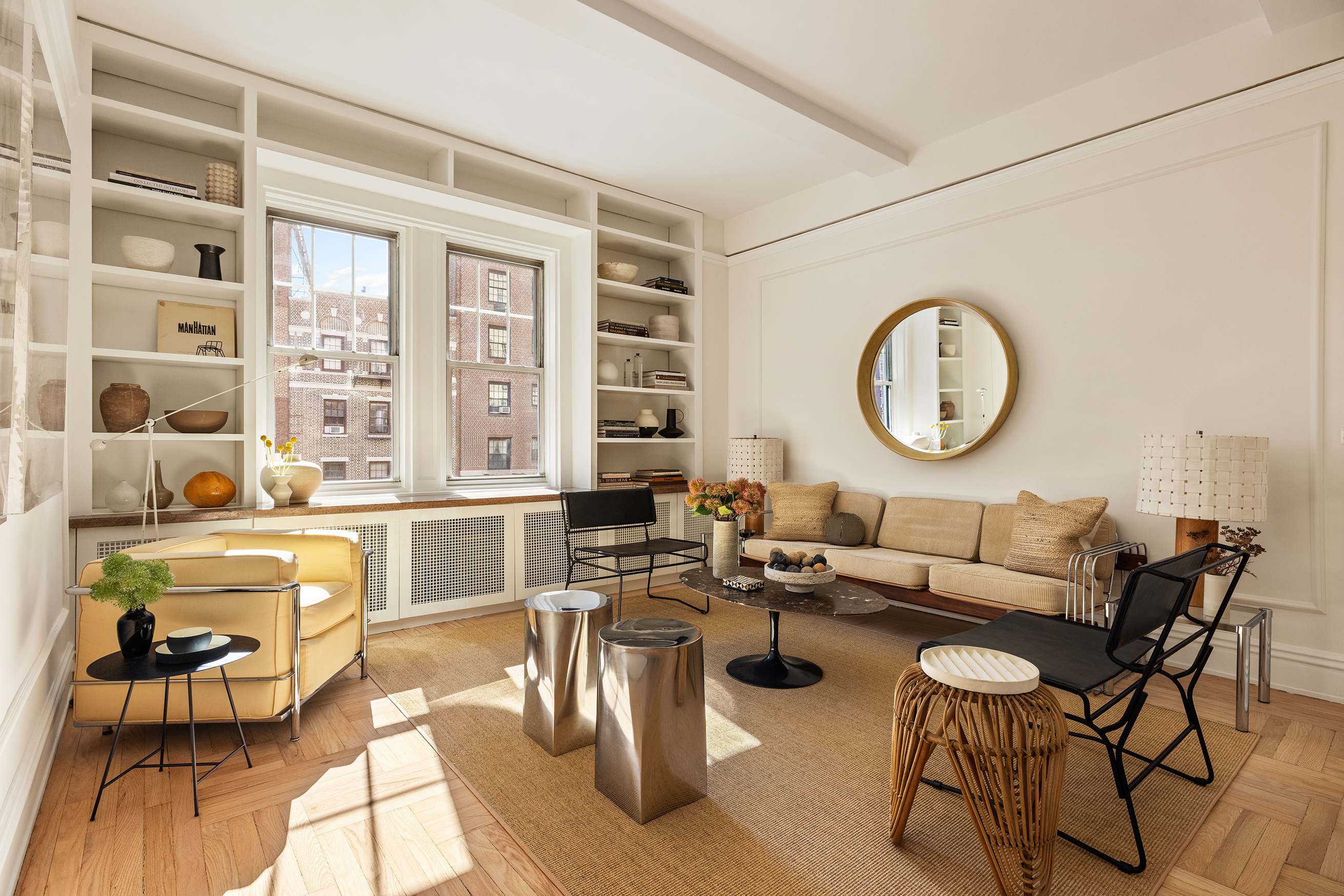 30 5th Avenue, Unit 6H Manhattan, NY 10011 - Photo 4 of 17 a living room with fireplace furniture and a large window