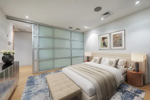 a bedroom with a bed and a cabinets