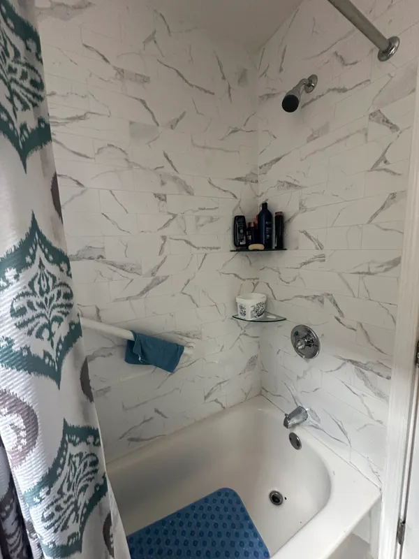 a bathroom with a sink and a shower