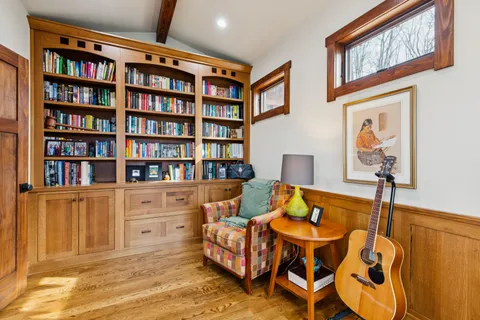 a bedroom with a large bed and a large window