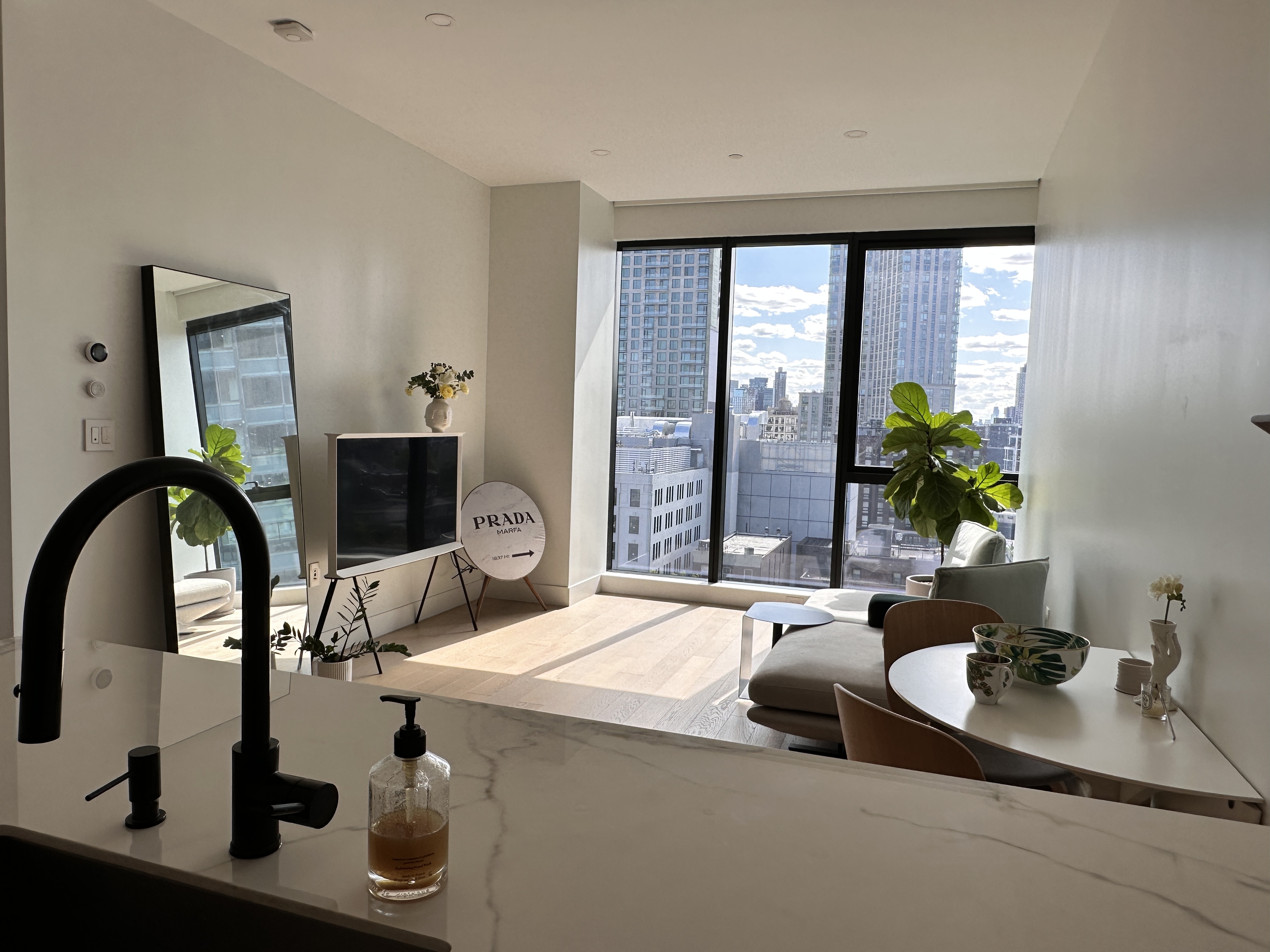 4507 Court Square West, Unit 10E Queens, NY 11101 - Photo 4 of 14 a living room with furniture and window