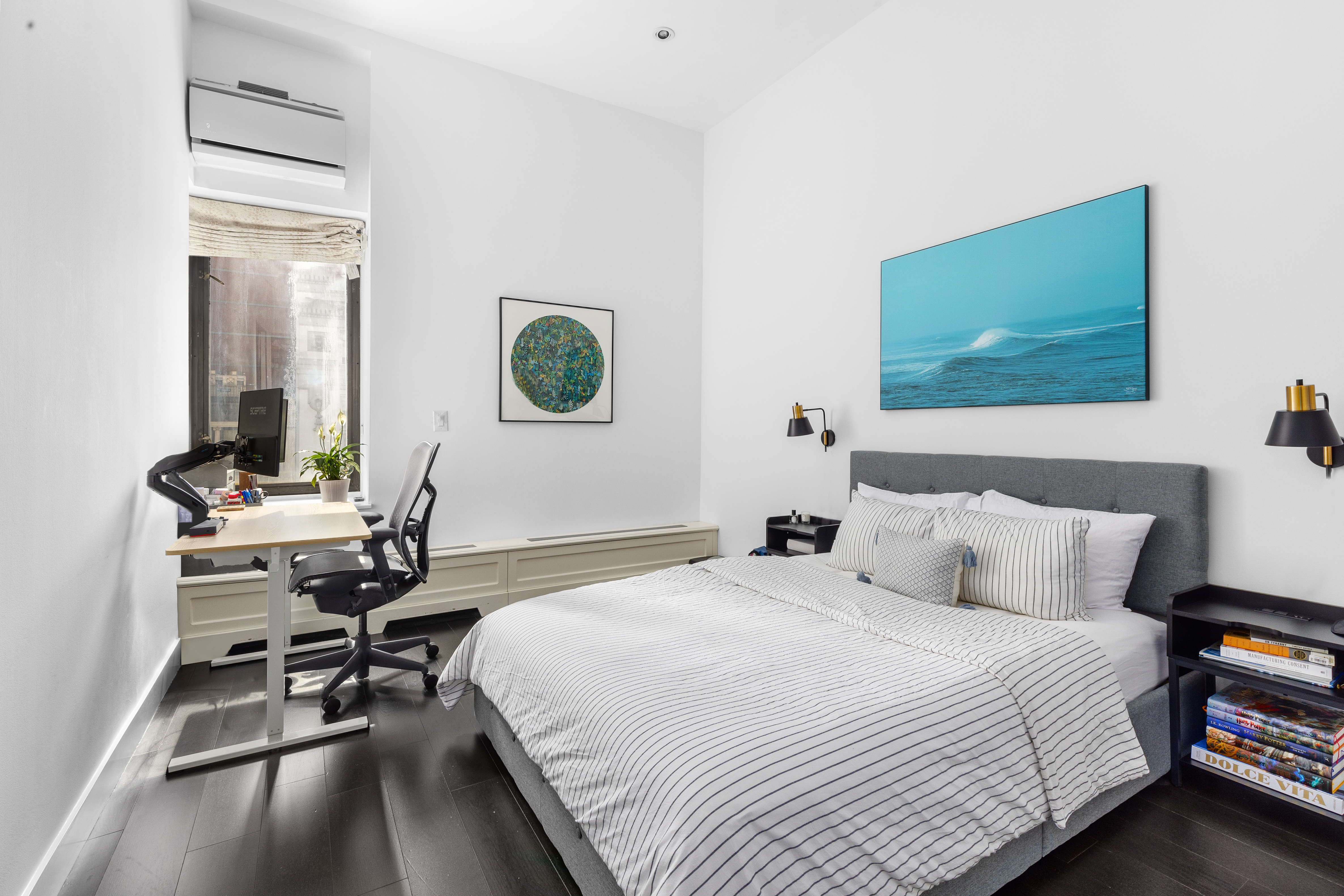 372 5th Avenue, Unit 5F Manhattan, NY 10018 - Photo 4 of 9 a bedroom with a bed and a table in it