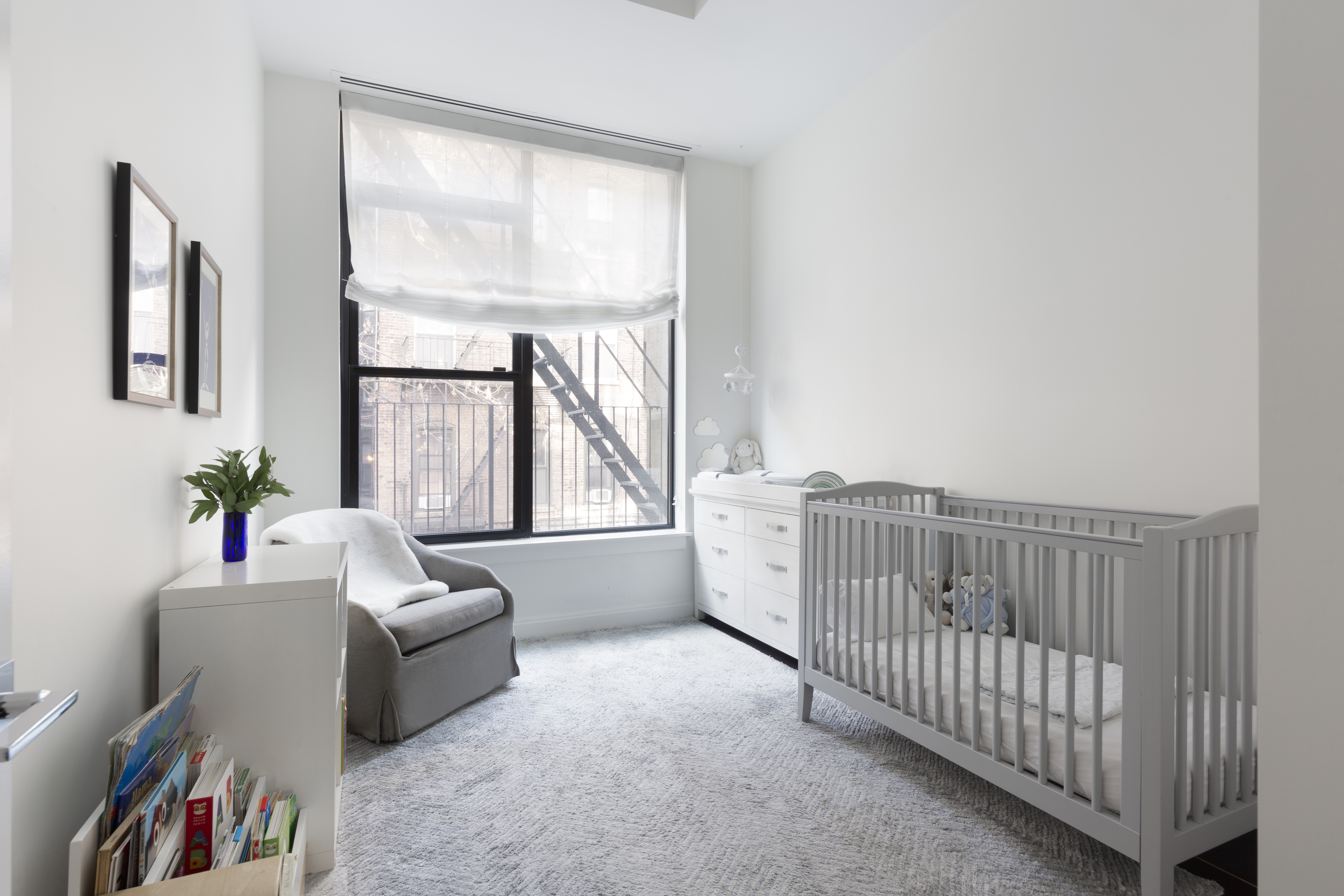 320 West 115th Street Manhattan, NY 10026 - Photo 6 of 11 a living room with furniture and a large window
