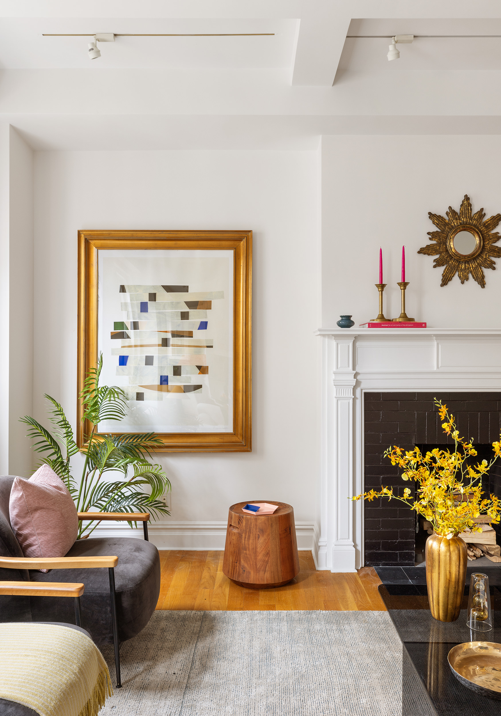 25 5th Avenue, Unit 9A Manhattan, NY 10003 - Photo 13 of 16 a living room with furniture and a fireplace