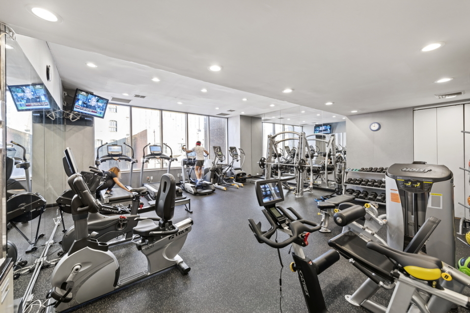 200 East 89th Street, Unit 34CD Manhattan, NY 10128 - Photo 18 of 20 a view of a room with gym equipment