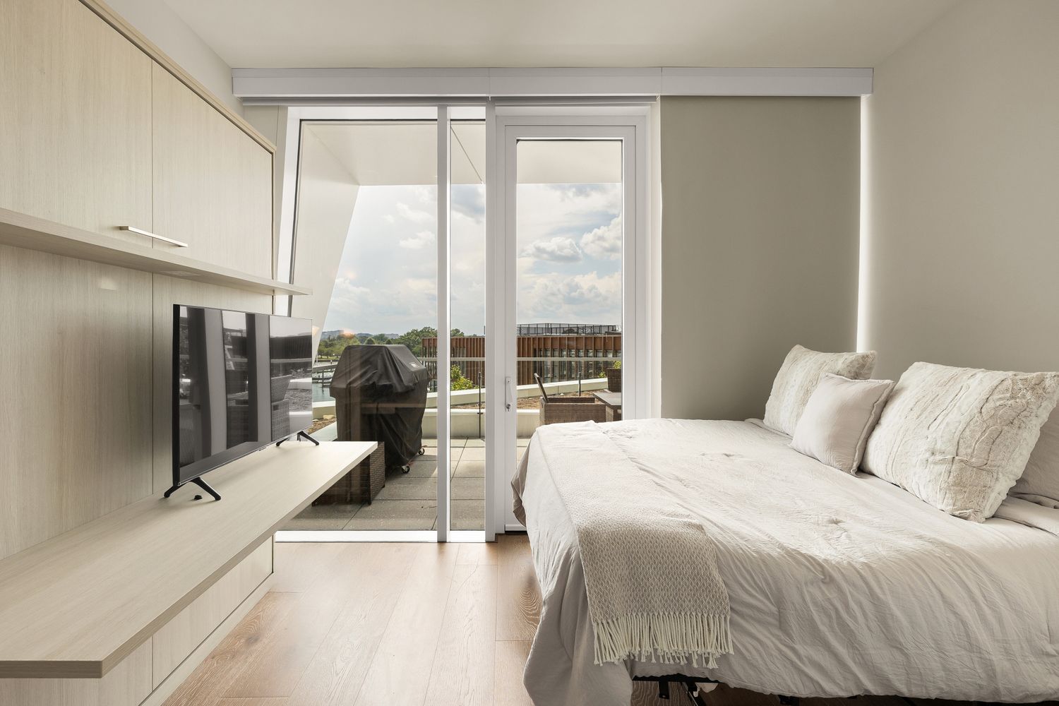 a living room with furniture and a flat screen tv