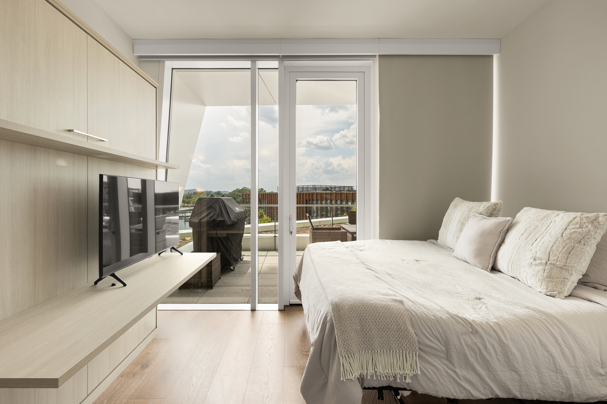 Address Upon Request Washington, DC 20024 - Photo 41 of 84 a bedroom with a bed and large windows