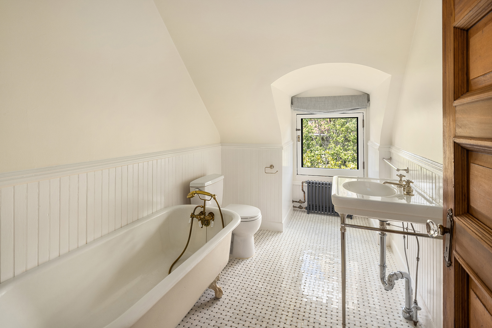 18 Prospect Park West Brooklyn, NY 11215 - Photo 27 of 33 a spacious bedroom with a bed a table and a window