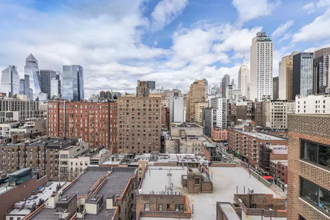 a view of city with tall buildings