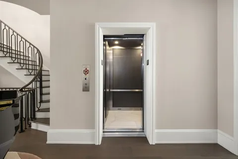 a view of entryway with wooden floor