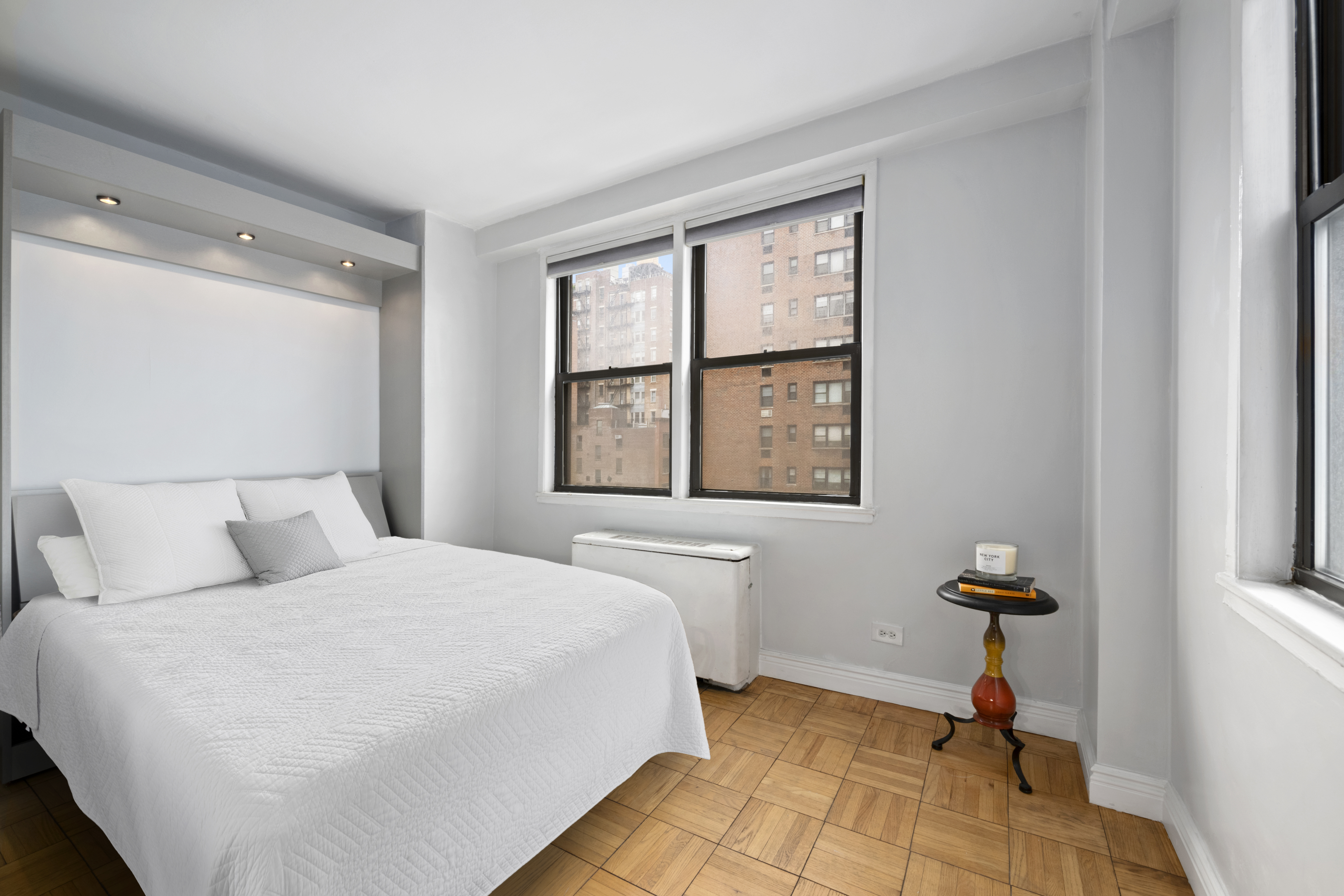 201 East 21st Street, Unit 7A Manhattan, NY 10010 - Photo 6 of 7 a bedroom with a bed and a window