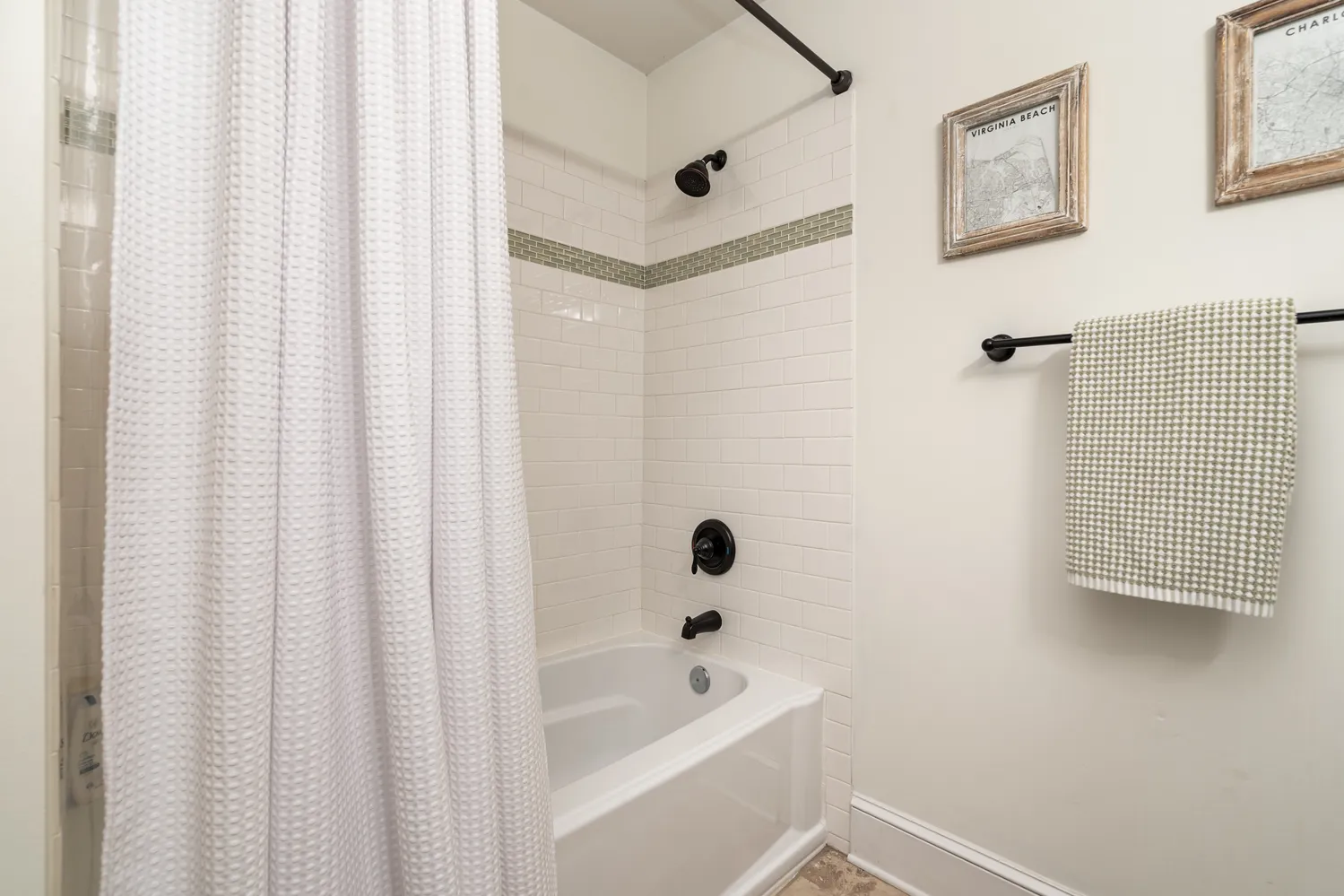 a bathroom with a shower curtain and a sink