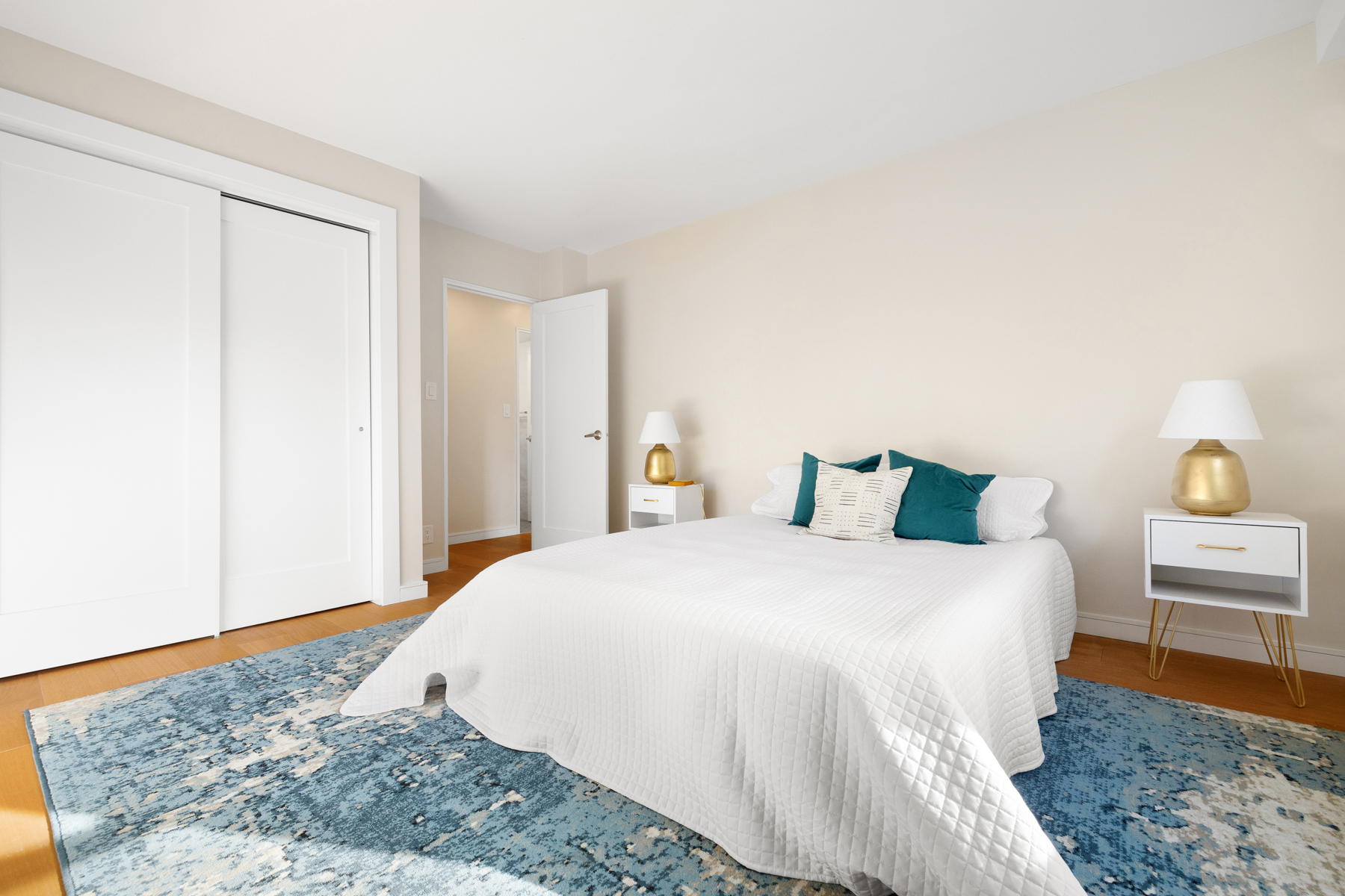 35-51 85th Street, Unit 5E Queens, NY 11372 - Photo 12 of 16 a bedroom with a bed and a couch