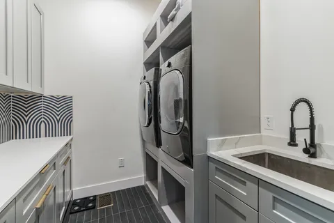 a kitchen with a sink and a stove