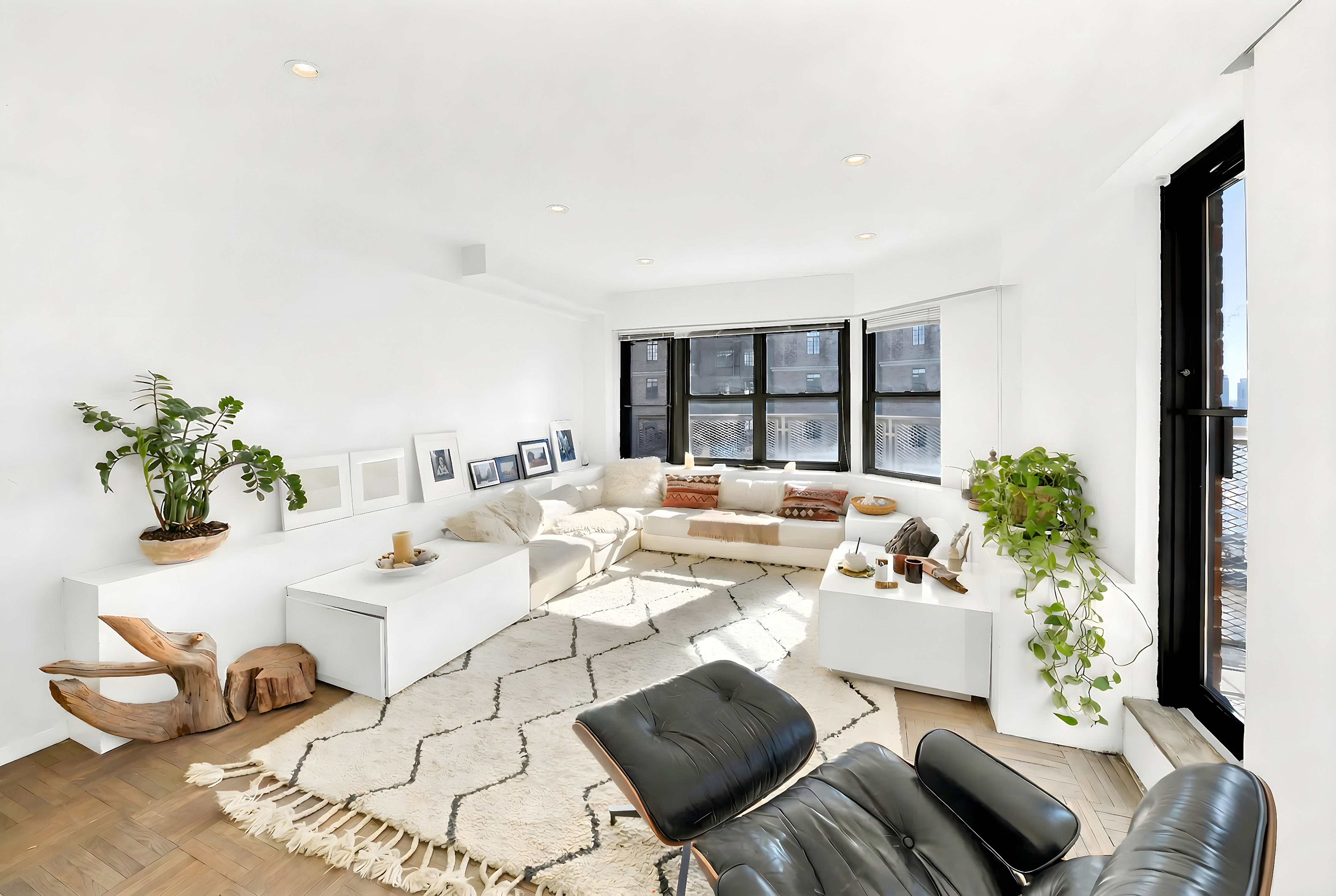 2 Tudor City Place, Unit 15AS Manhattan, NY 10017 - Photo 3 of 17 a living room with furniture and a potted plant