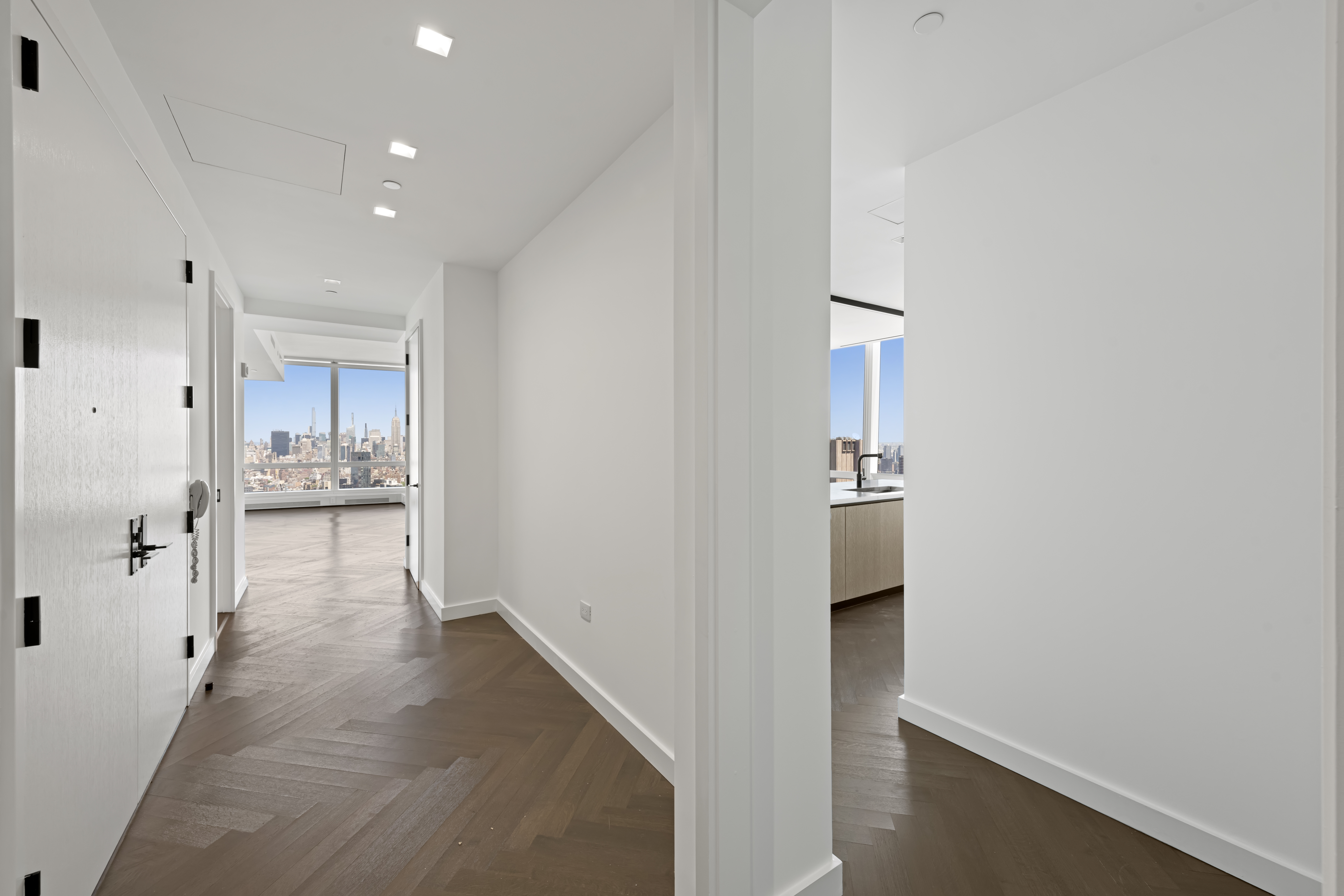 111 Murray Street, Unit 51EAST Manhattan, NY 10007 - Photo 11 of 42 a view of a hallway with wooden floor and a bathroom