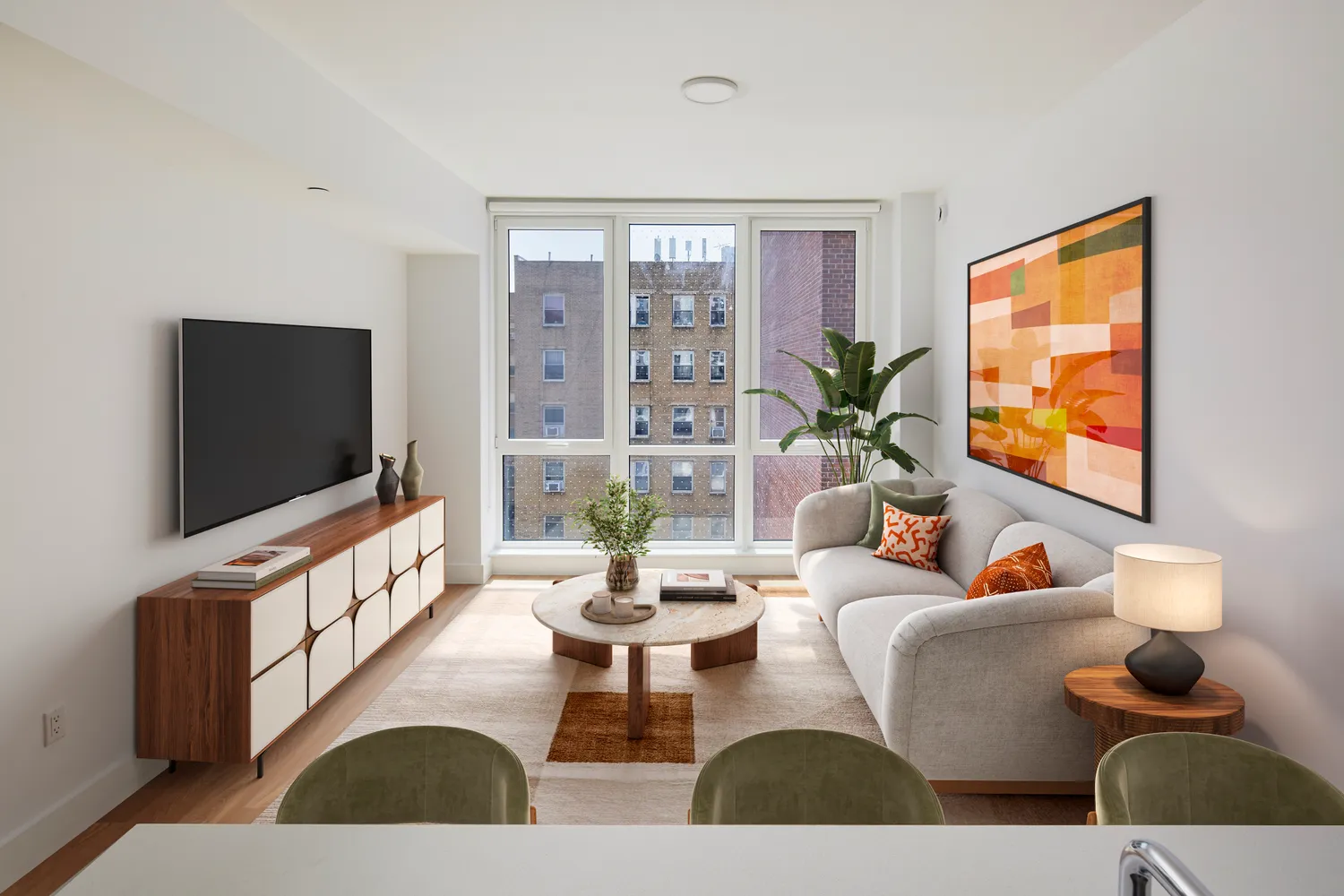 a living room with furniture and a flat screen tv