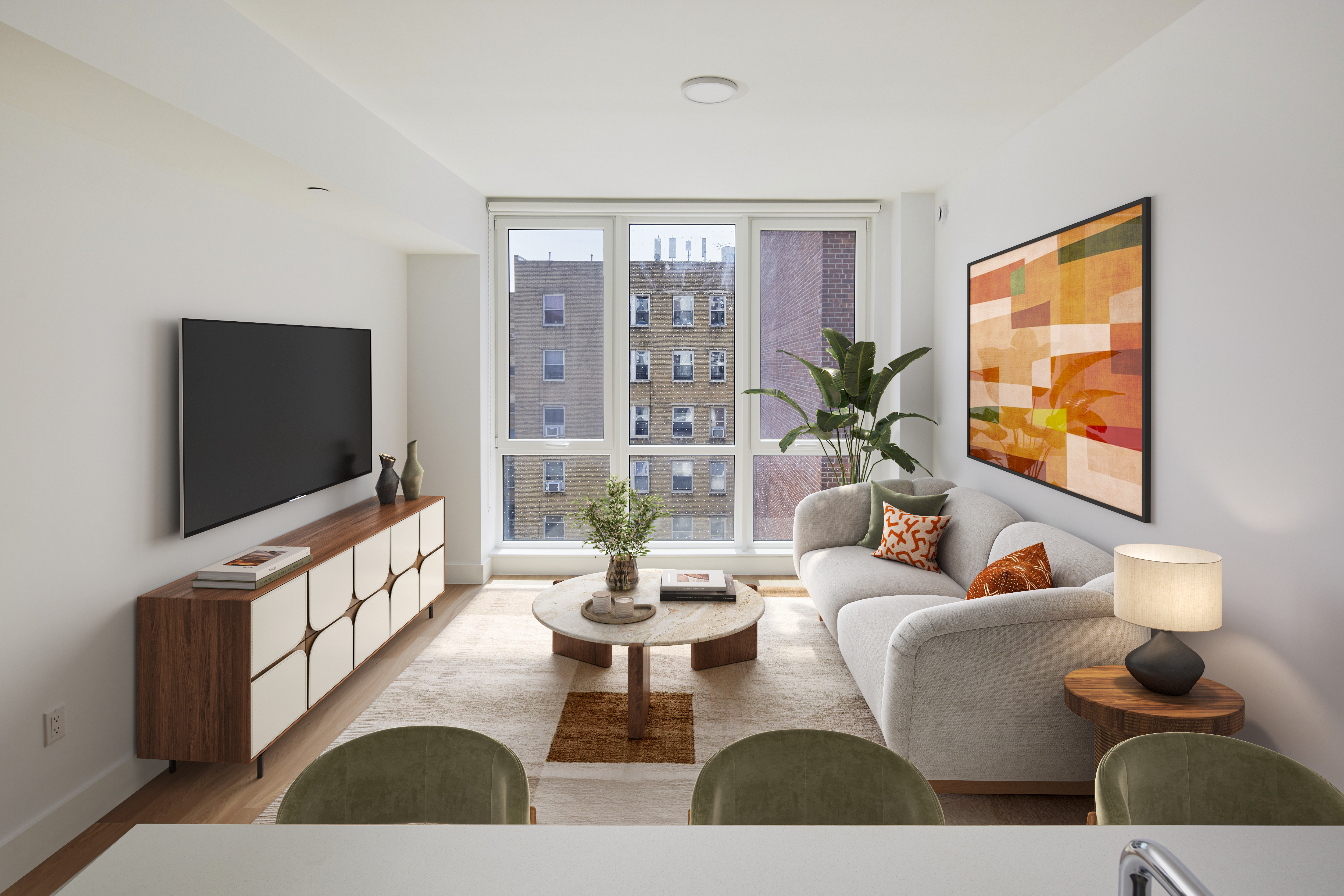 a living room with furniture and a flat screen tv