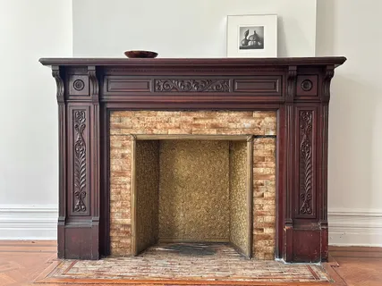 a view of fireplace and wooden floor