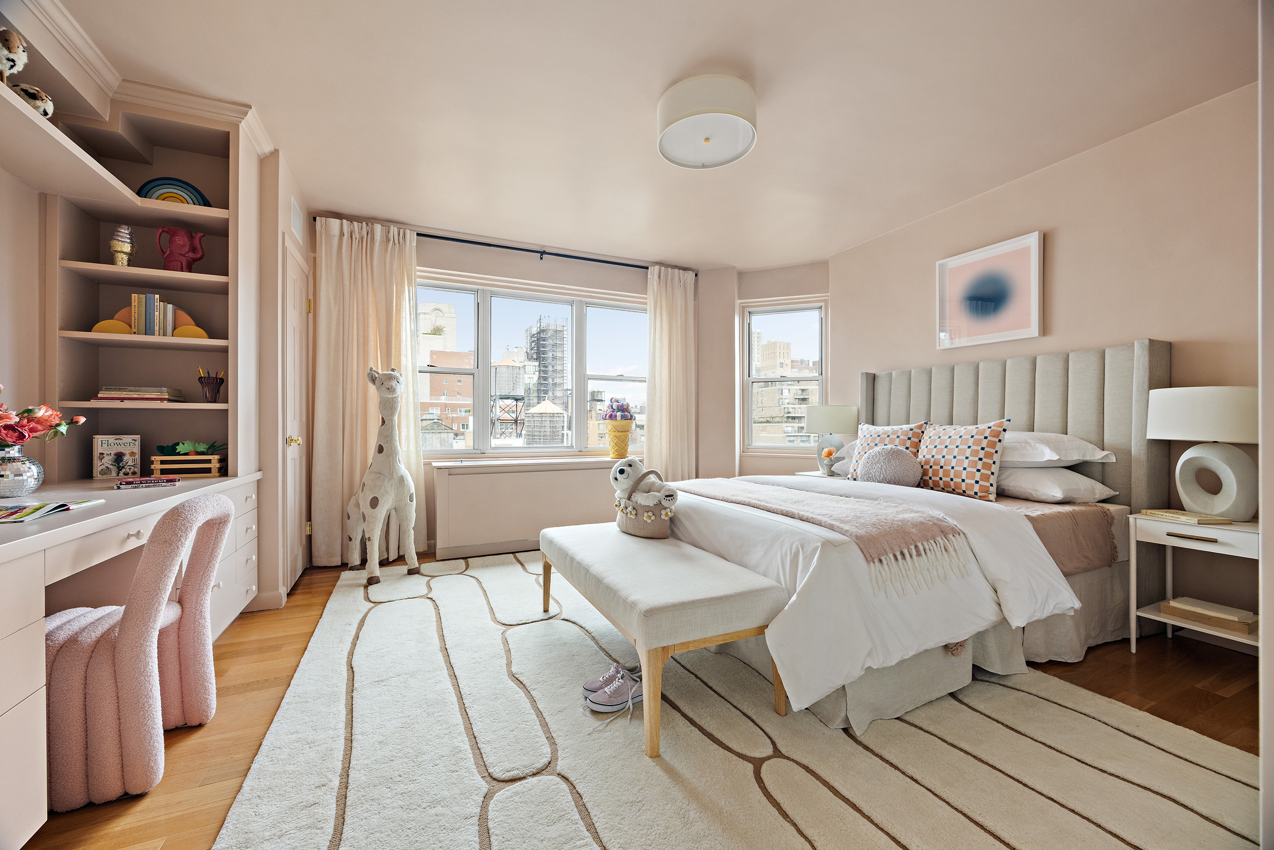 40 East 84th Street, Unit 17A Manhattan, NY 10028 - Photo 10 of 16 a large bedroom with a bed and a view of kitchen