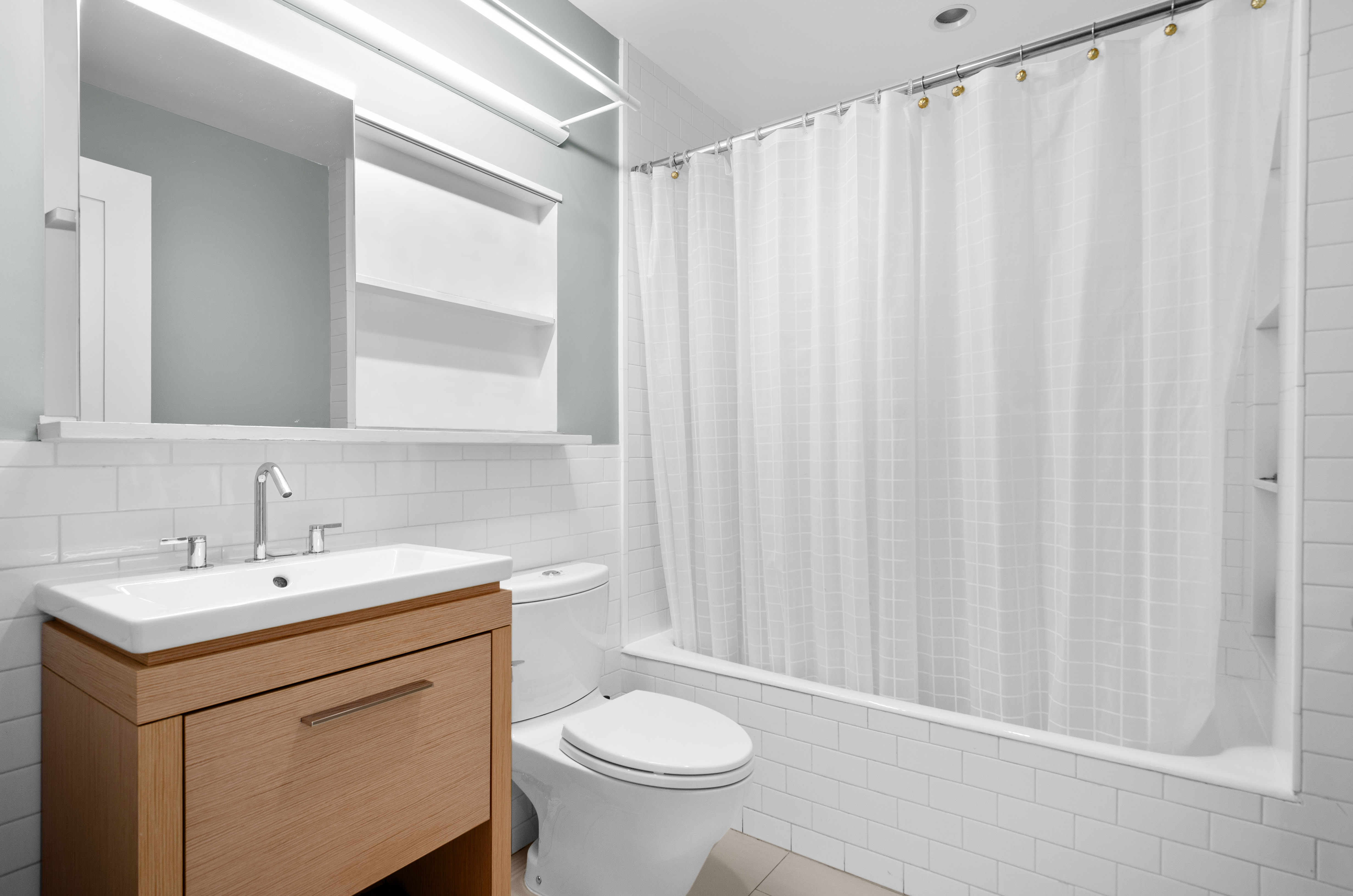 301 State Street Brooklyn, NY 11201 - Photo 8 of 14 a bathroom with a sink a toilet and a mirror
