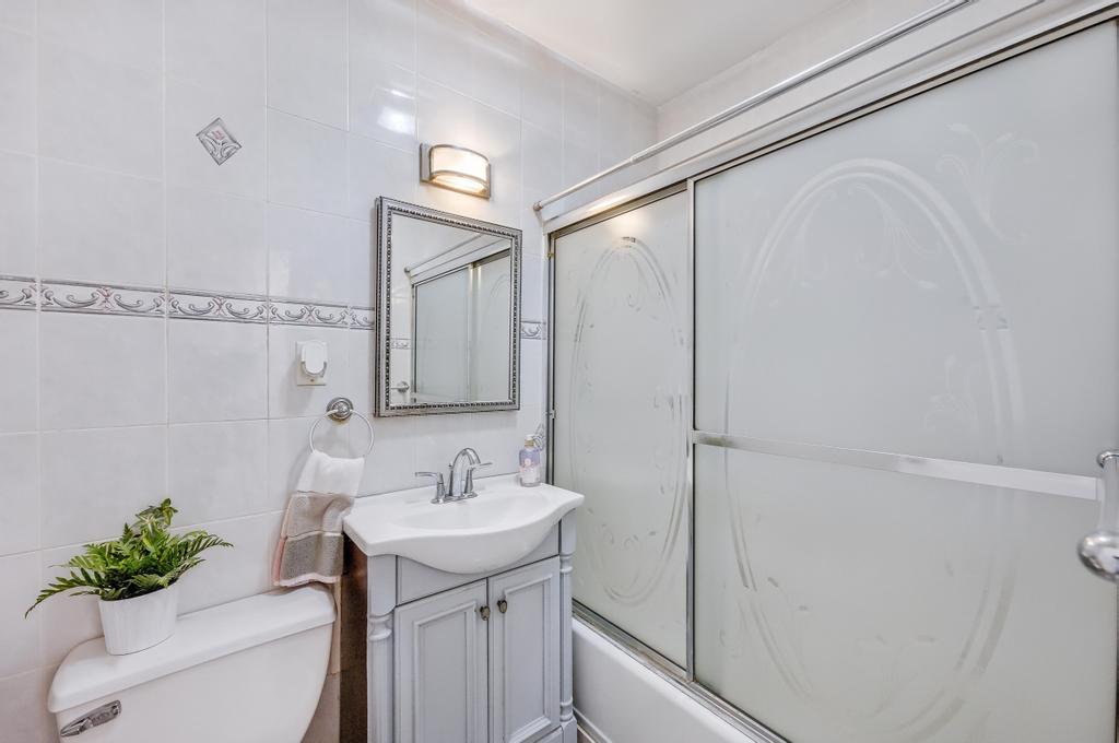 57 Carroll Street, Unit 38A Brooklyn, NY 11231 - Photo 16 of 21 a bathroom with a sink a mirror and a shower