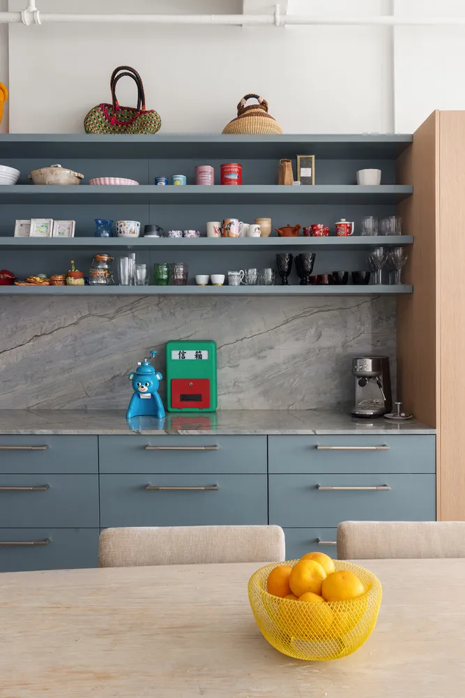 a kitchen with a stove and a shelf