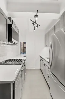 a kitchen that has a cabinets and a stove