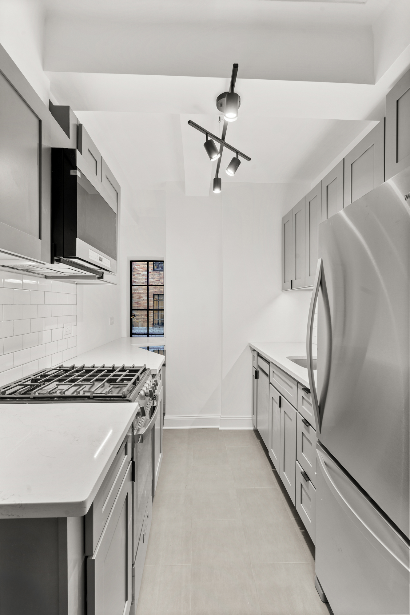 10 Park Avenue, Unit 6A Manhattan, NY 10016 - Photo 8 of 14 a kitchen that has a cabinets and a stove