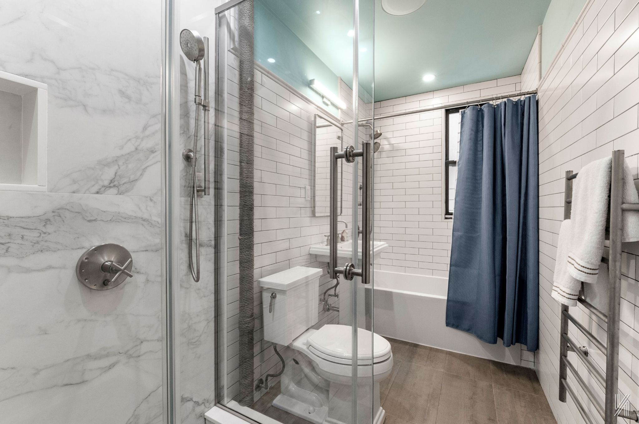 35-06 88th Street, Unit 3G Queens, NY 11372 - Photo 15 of 20 a bathroom with a granite countertop shower a toilet and a sink