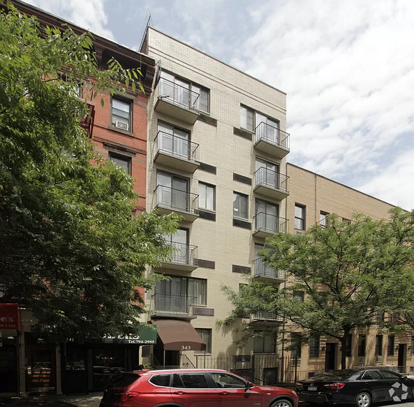 343 East 76th Street, Unit 4C Manhattan, NY 10021 - Photo 7 of 8 a view of a building with a street