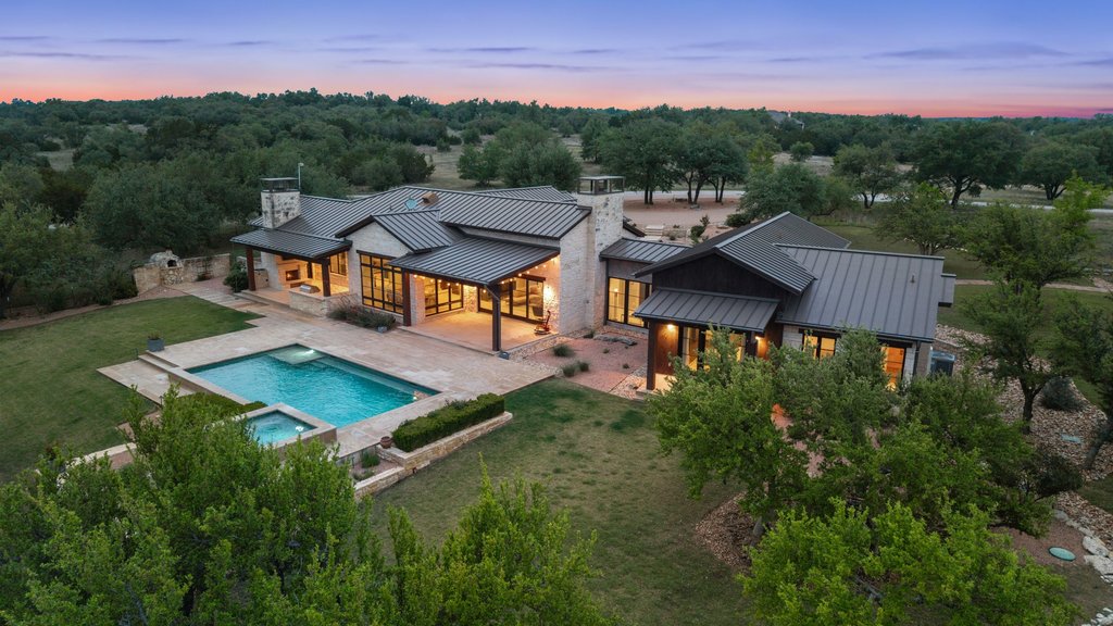 2560 Bell Springs Road Dripping Springs, TX 78620 - Photo 26 of 42 an aerial view of a house with pool garden and lake view
