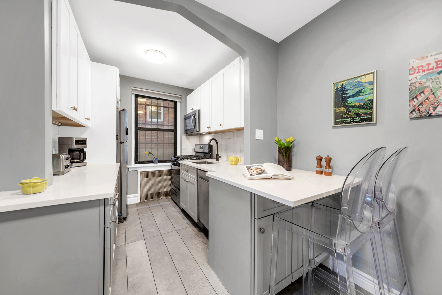 385 Argyle Road, Unit 1B Brooklyn, NY 11218 - Photo 4 of 11 a kitchen with a sink a stove cabinets and a living room