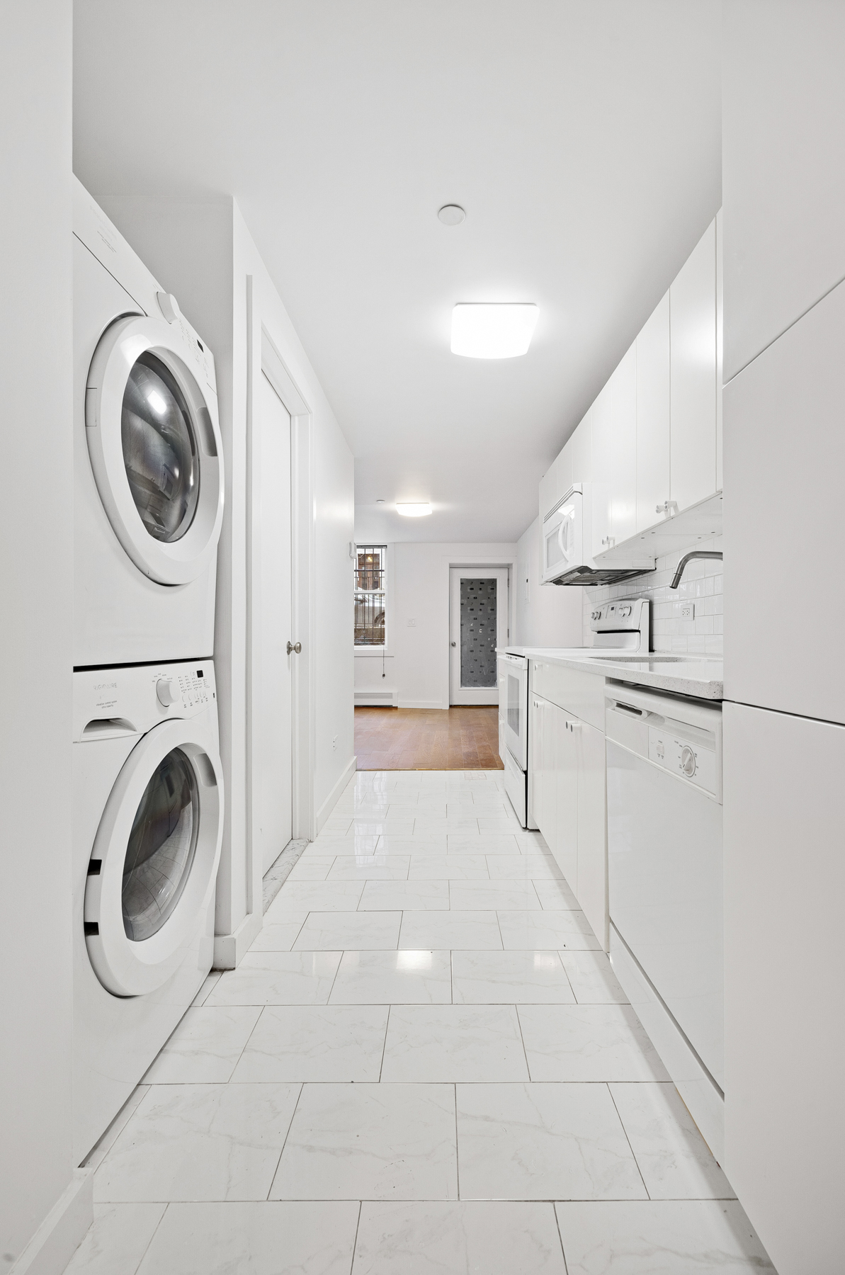 63 Putnam Avenue Brooklyn, NY 11238 - Photo 7 of 11 a view of a kitchen with electric appliances