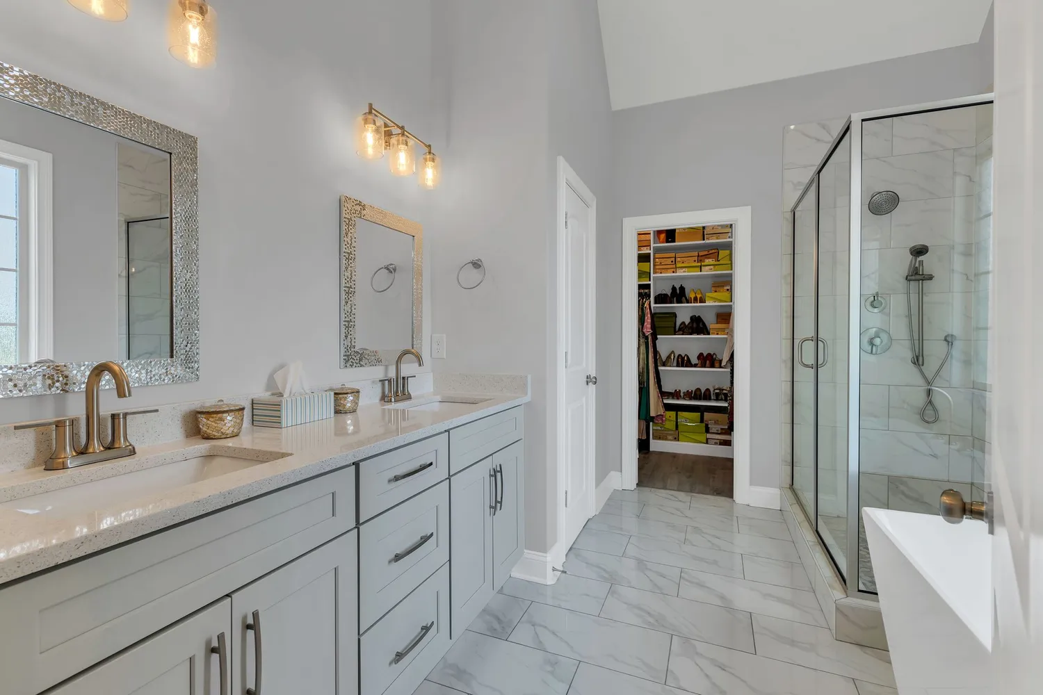 a spacious bathroom with a granite countertop sink mirror and shower