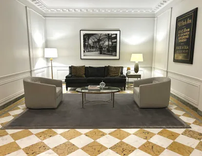 a living room with furniture and a rug