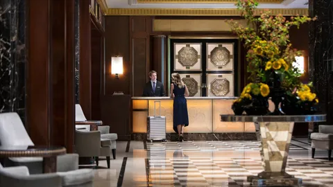 a front view of a house with wooden floor and windows