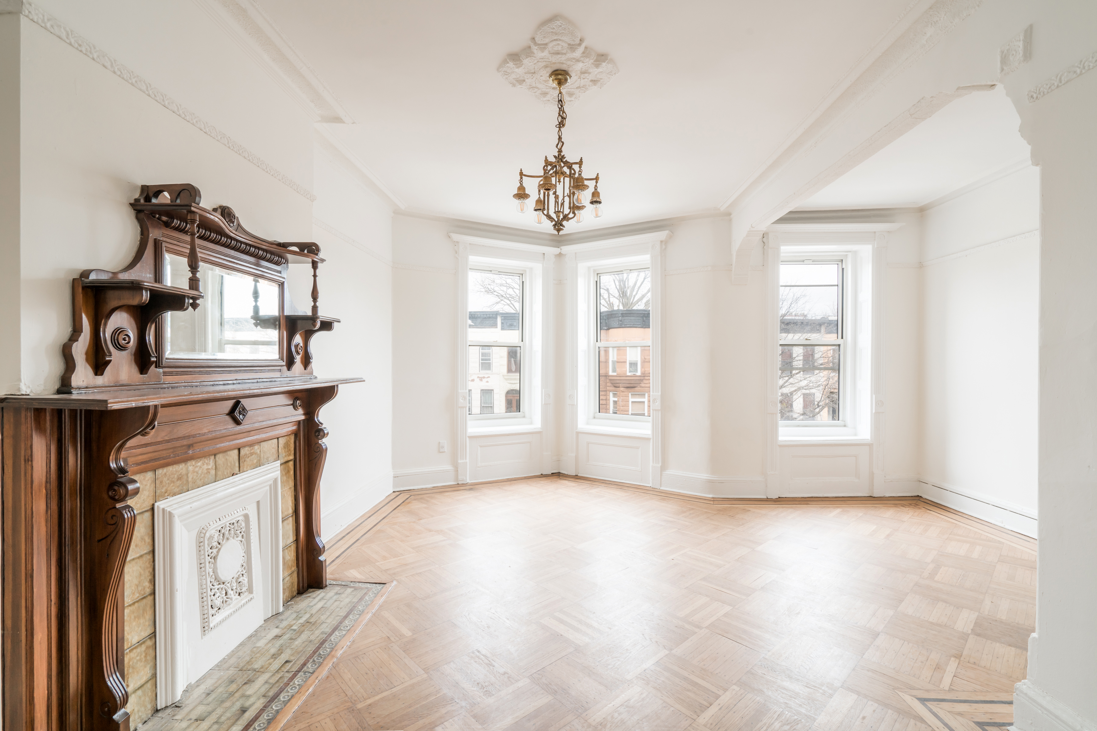670 Macon Street, Unit 2 Brooklyn, NY 11233 - Photo 6 of 16 a view of a room with windows and cabinet