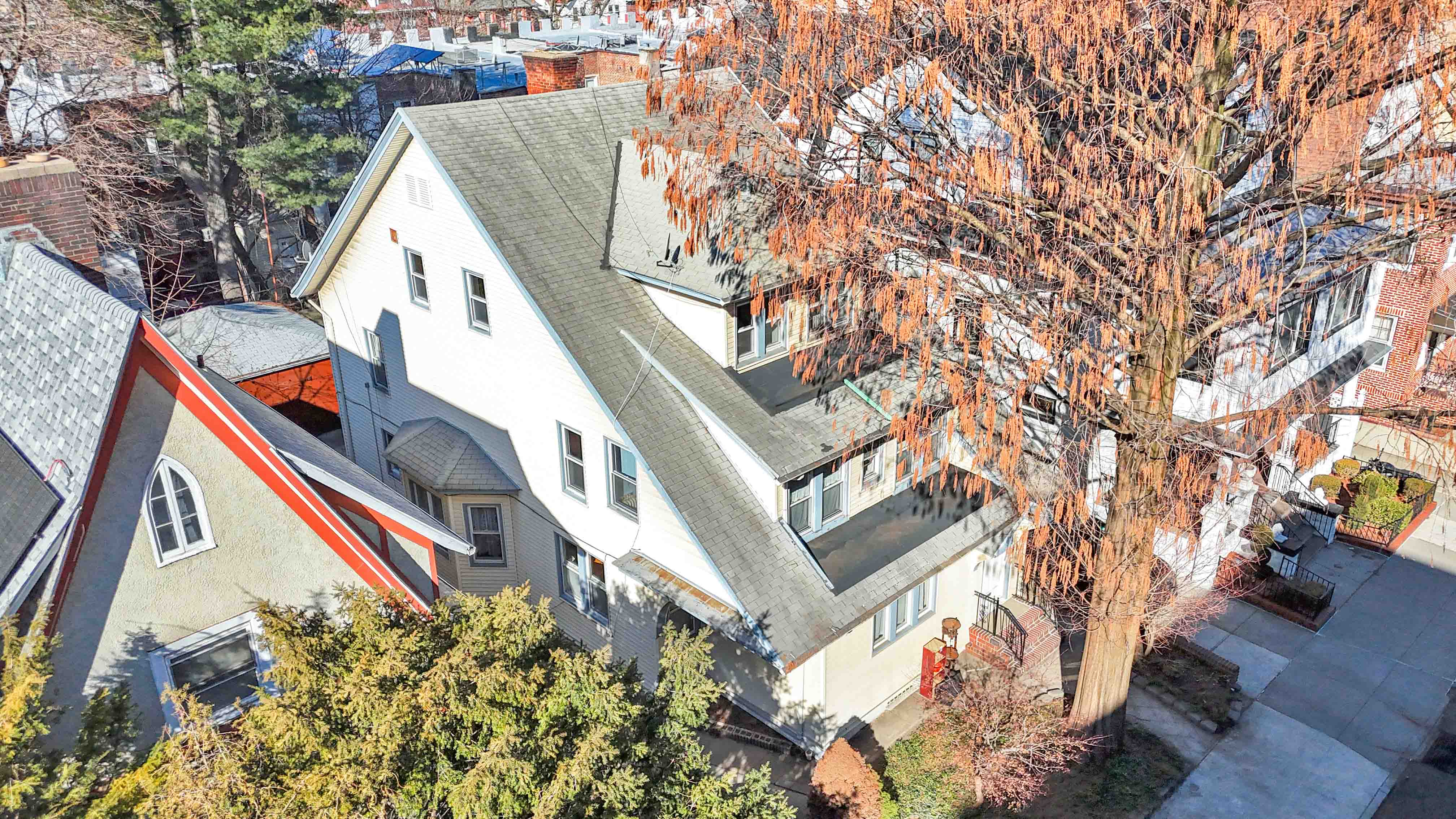 642 East 26th Street Brooklyn, NY 11210 - Photo 31 of 32 a view of a house with a tree
