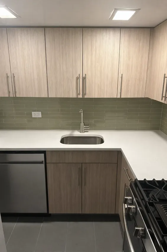 a kitchen with a sink and cabinets