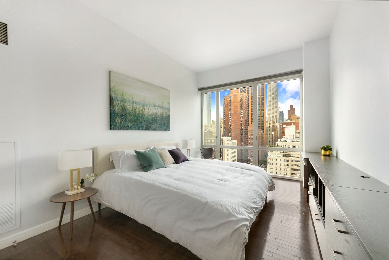 225 East 34th Street, Unit PHD Manhattan, NY 10016 - Photo 3 of 12 a bedroom with a bed and a large window