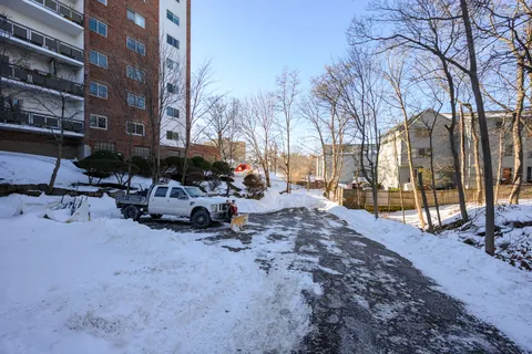 a view of a yard with a building